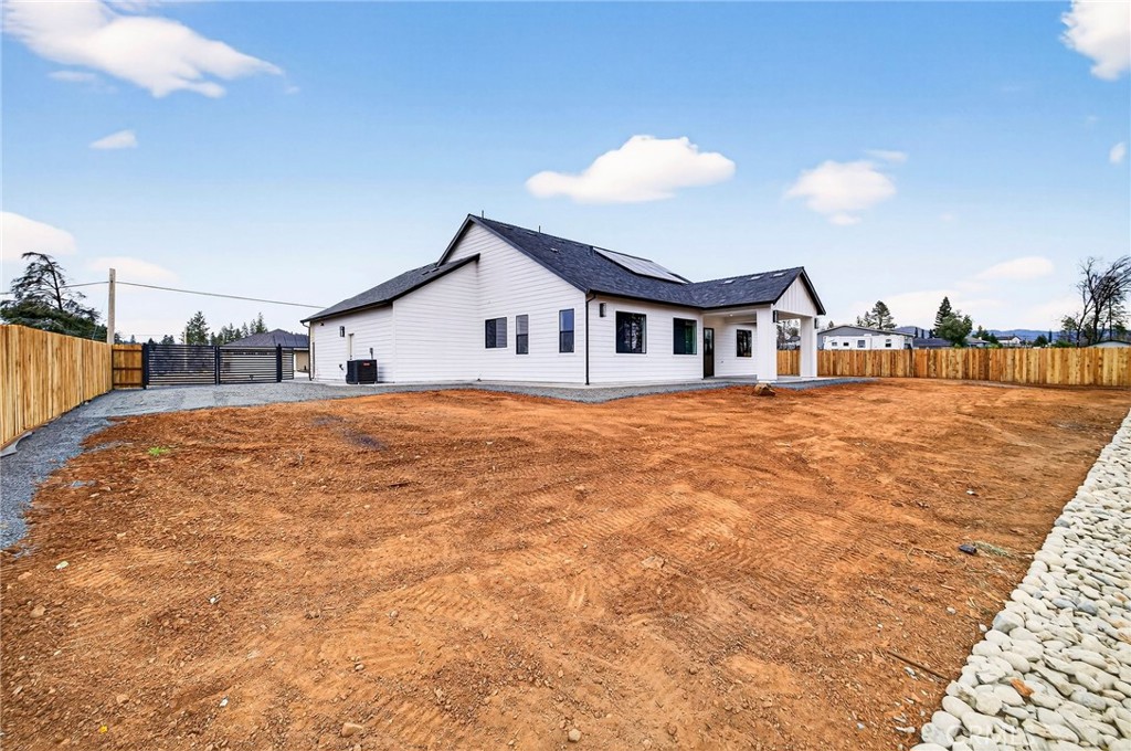 2210 Thornburg Road Paradise, CA 95969 - Photo 56 of 75 a view of a house with a yard and potted plants