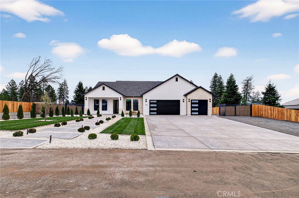 2210 Thornburg Road Paradise, CA 95969 - Photo 9 of 75 a front view of a house with a yard and garage