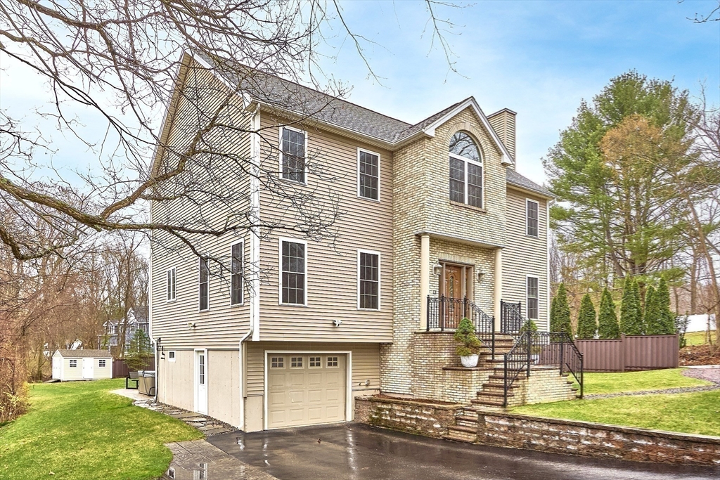 a front view of a house with garden