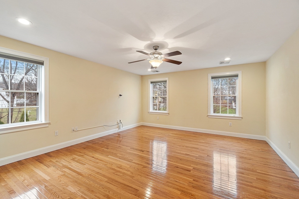 49 Brigham Hill Road Grafton, MA 01519 - Photo 16 of 37 a view of an empty room with wooden floor and a window