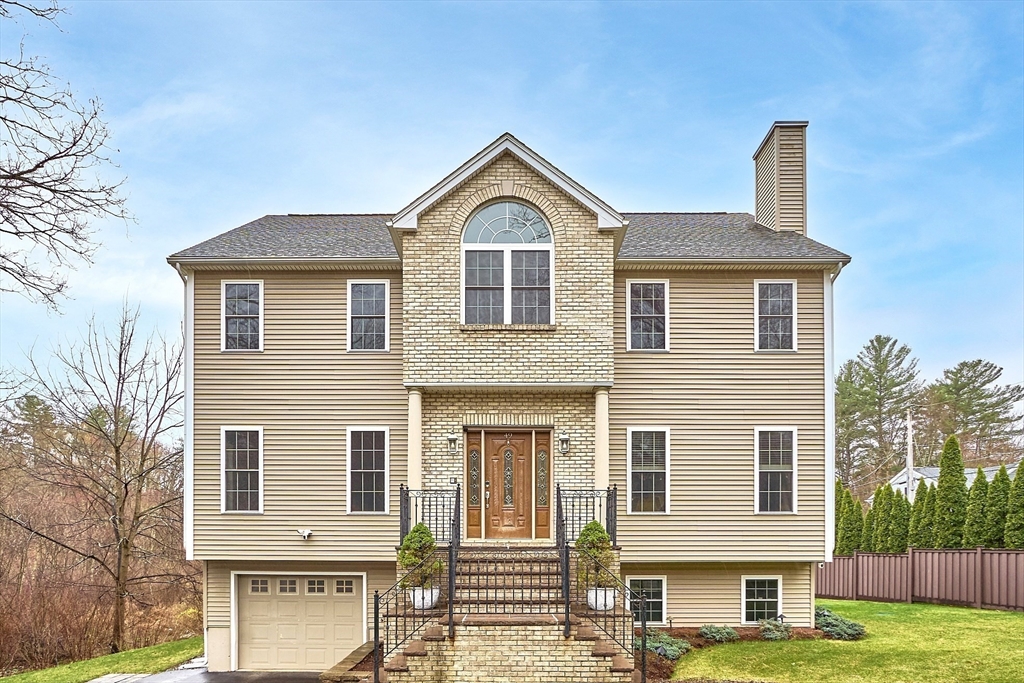 49 Brigham Hill Road Grafton, MA 01519 - Photo 2 of 37 a front view of a house with a yard