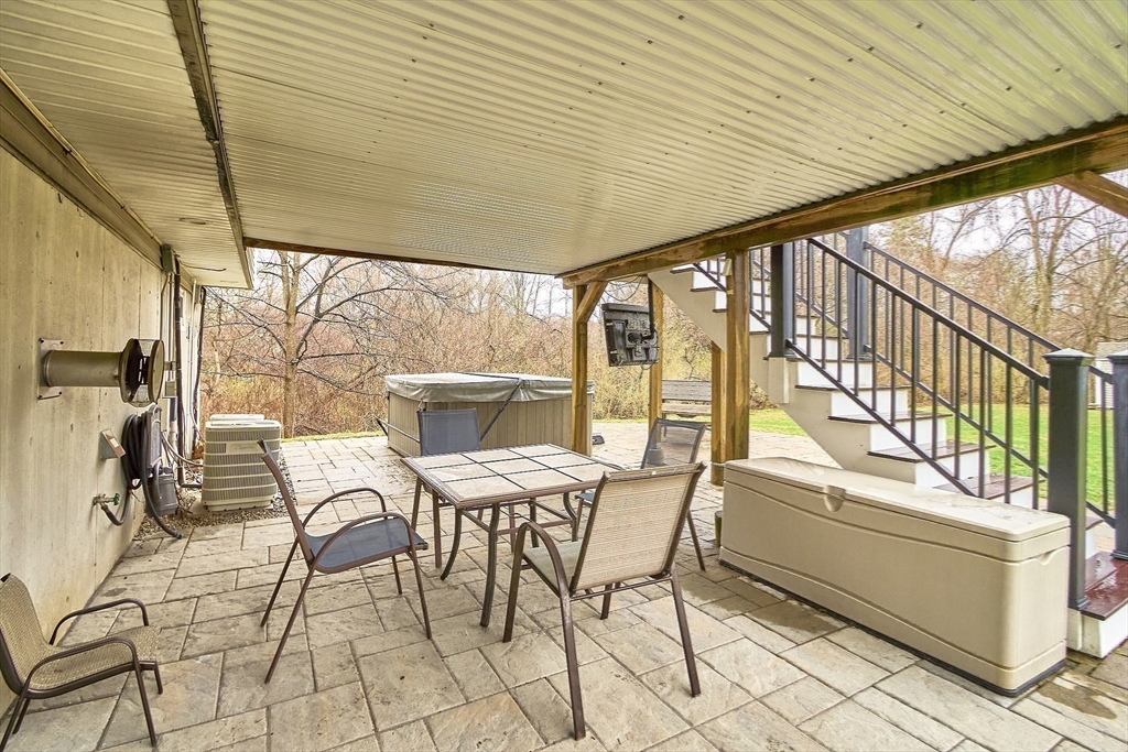49 Brigham Hill Road Grafton, MA 01519 - Photo 34 of 37 a outdoor space with chairs