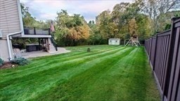49 Brigham Hill Road Grafton, MA 01519 - Photo 36 of 37 a view of a chairs and table in the back yard