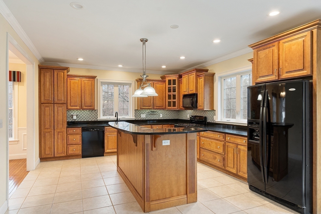 49 Brigham Hill Road Grafton, MA 01519 - Photo 10 of 37 a kitchen with stainless steel appliances granite countertop wooden cabinets a sink a stove a refrigerator and a oven