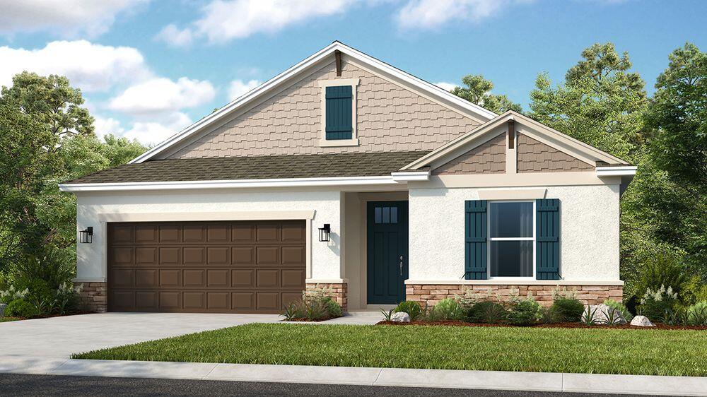 604 Southeast Ranch Oak Circle Port St. Lucie, FL 34984 - Photo 1 of 35 a front view of a house with a yard