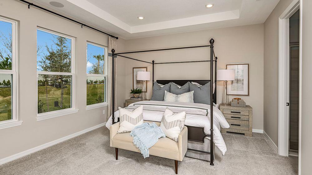 604 Southeast Ranch Oak Circle Port St. Lucie, FL 34984 - Photo 11 of 35 a bedroom with a bed and a window