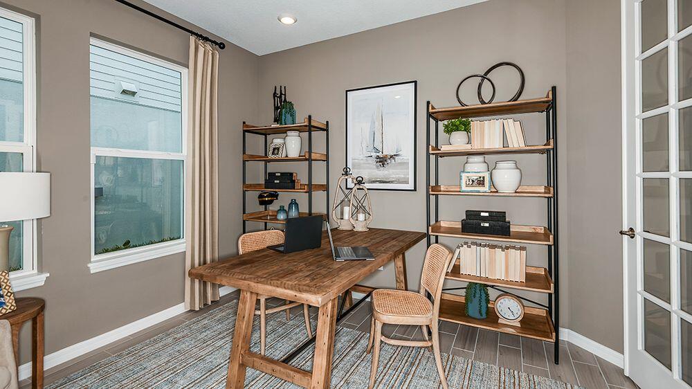 604 Southeast Ranch Oak Circle Port St. Lucie, FL 34984 - Photo 21 of 35 a view of a workspace with furniture and window