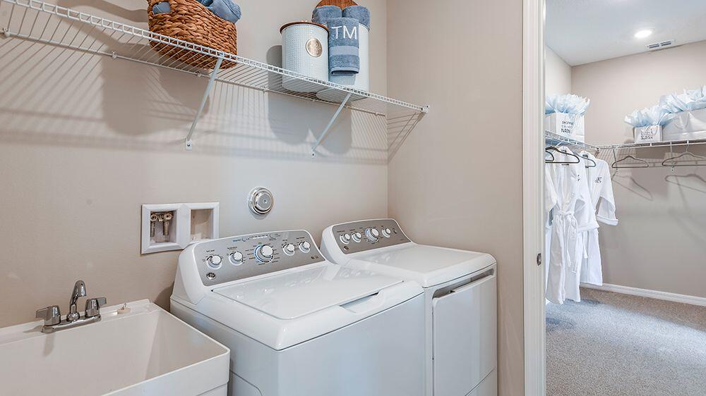 604 Southeast Ranch Oak Circle Port St. Lucie, FL 34984 - Photo 24 of 35 a utility room with dryer and washer