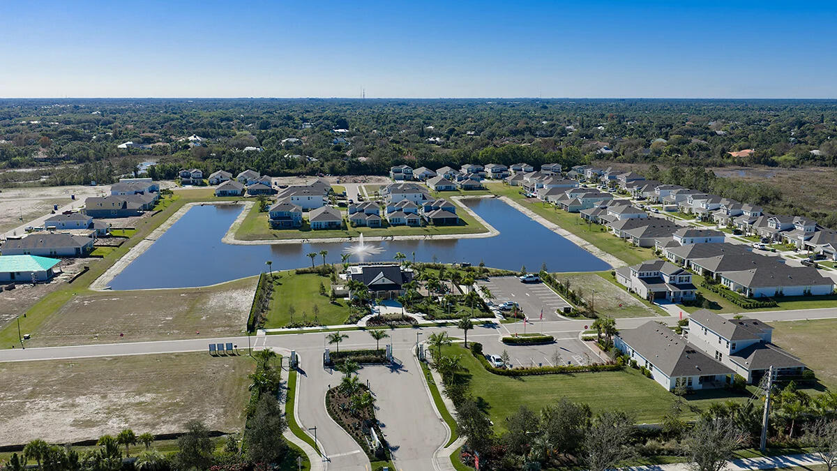 604 Southeast Ranch Oak Circle Port St. Lucie, FL 34984 - Photo 26 of 35 an aerial view of residential houses with outdoor space