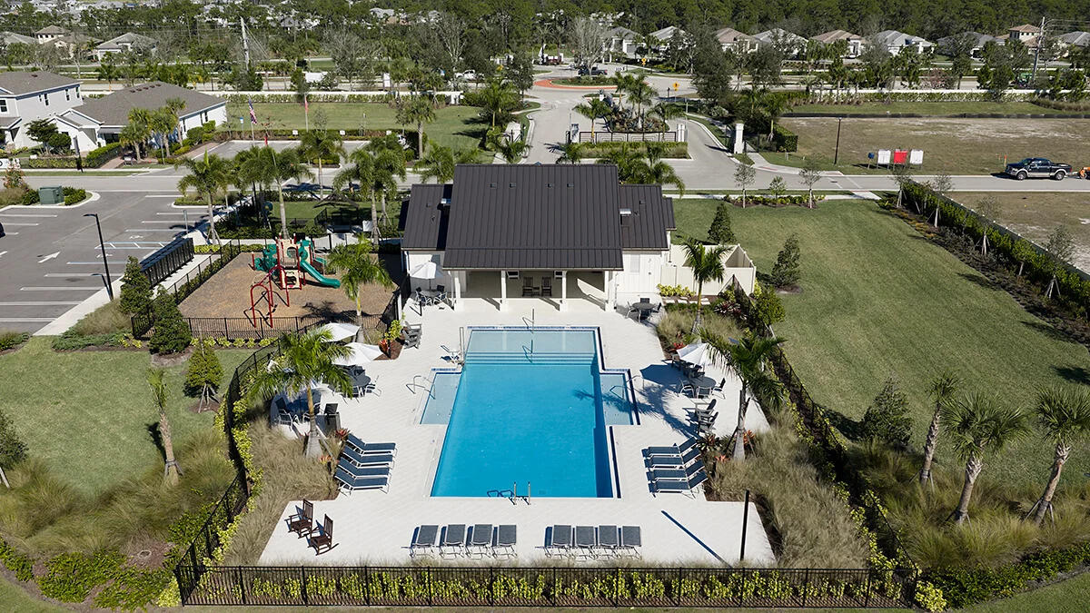 604 Southeast Ranch Oak Circle Port St. Lucie, FL 34984 - Photo 29 of 35 an aerial view of a house with a yard basket ball court and outdoor seating