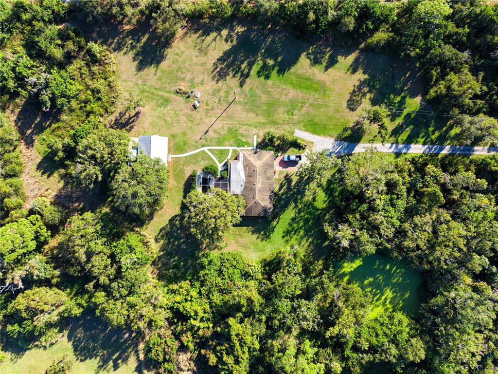 4855 Bliss Road Sarasota, FL 34233 - Photo 11 of 15 a view of a lake with a tree