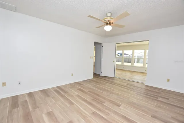 a view of a bathroom with a shower and a sink