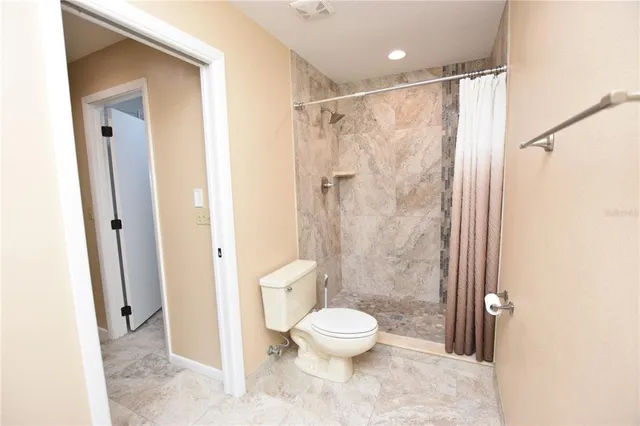 a bedroom with bed and wall painting on the wall