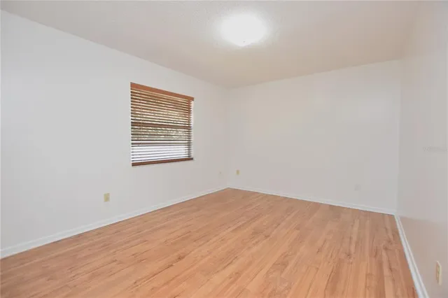 a view of a workspace with furniture and cabinet
