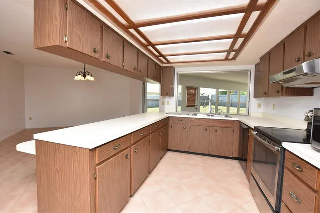 a kitchen with a sink and cabinets