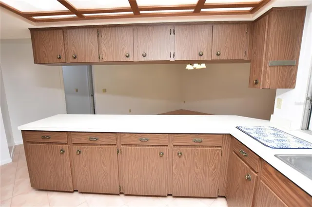 a kitchen with stainless steel appliances a refrigerator and a sink