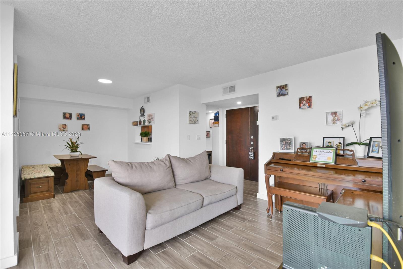 11800 Southwest 18th Street, Unit 5084 Miami, FL 33175 - Photo 1 of 44 a living room with furniture and a table