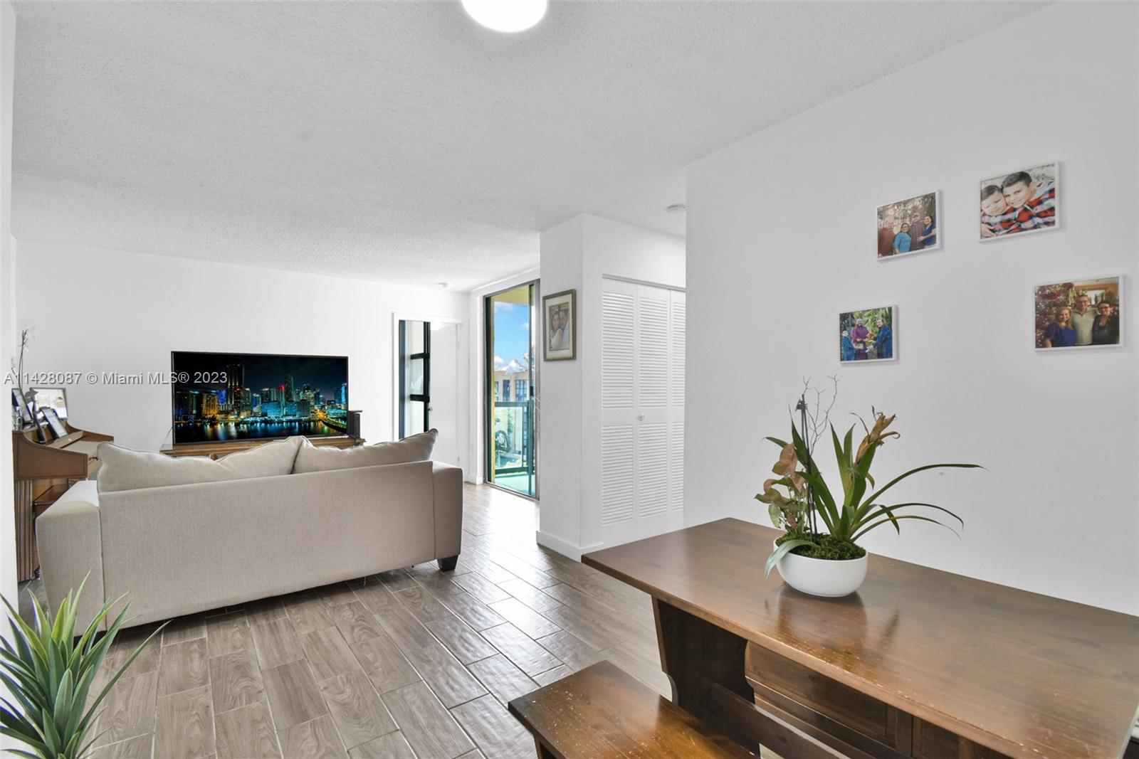 11800 Southwest 18th Street, Unit 5084 Miami, FL 33175 - Photo 12 of 44 a living room with furniture and a flat screen tv