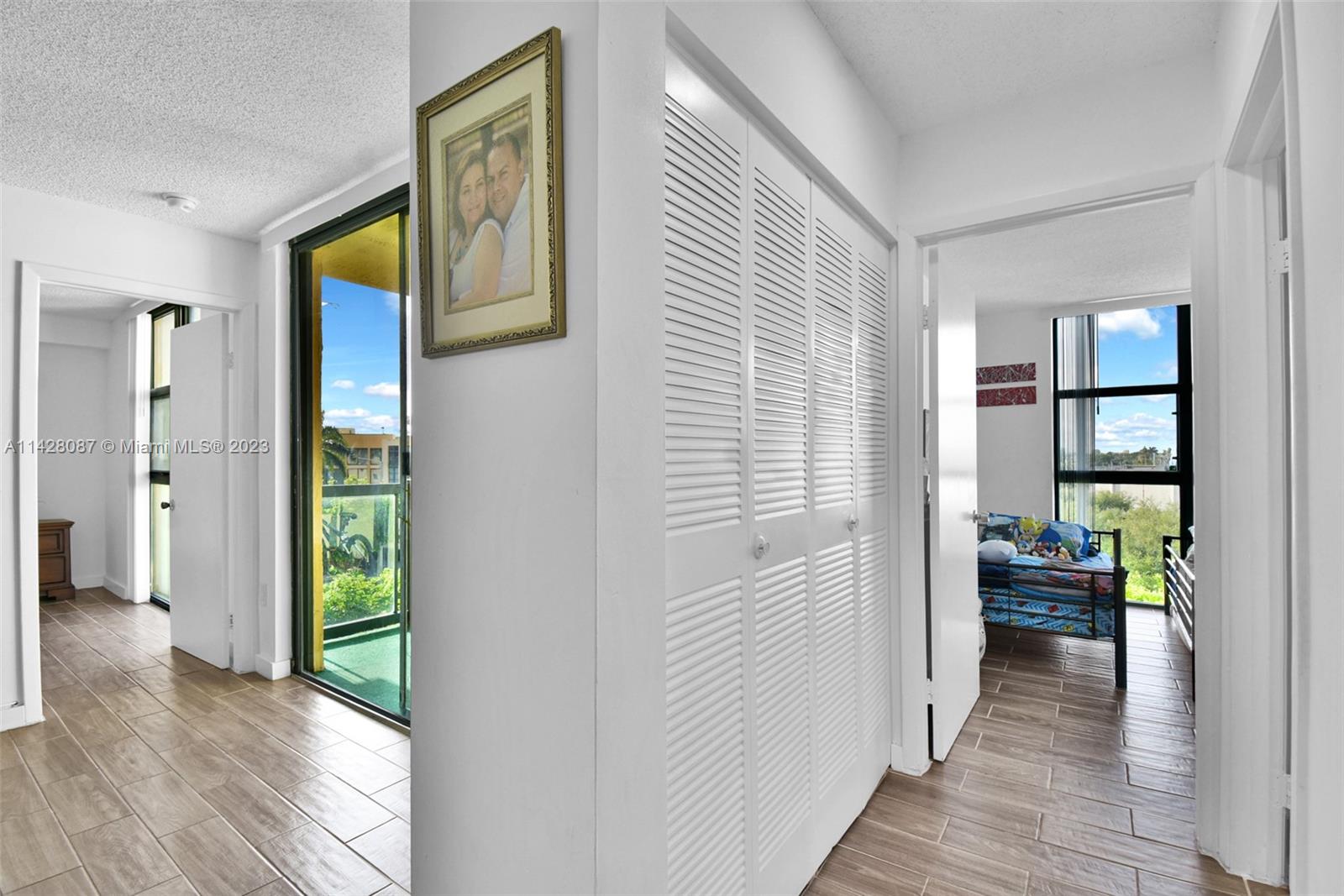 11800 Southwest 18th Street, Unit 5084 Miami, FL 33175 - Photo 15 of 44 a view of a hallway with wooden floor and windows