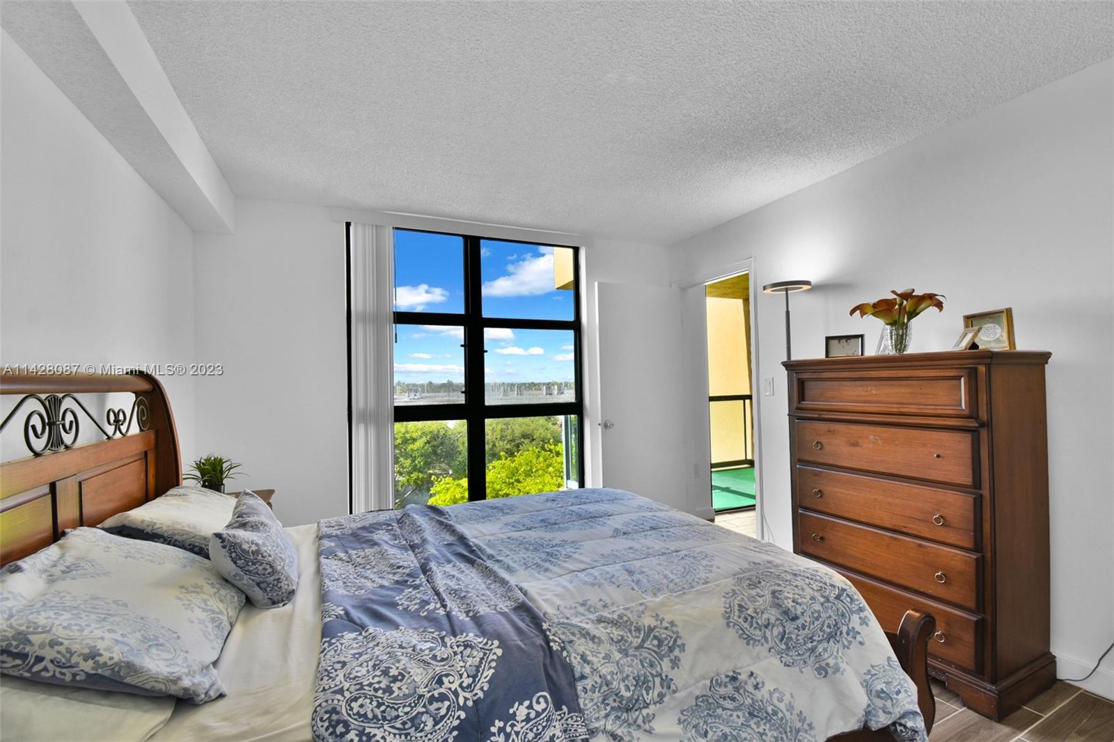 11800 Southwest 18th Street, Unit 5084 Miami, FL 33175 - Photo 18 of 44 a bedroom with a bed and a dresser