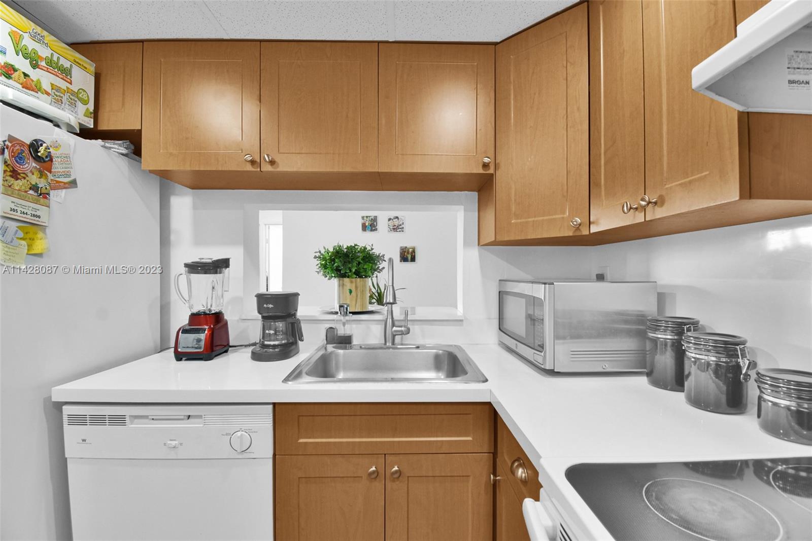 11800 Southwest 18th Street, Unit 5084 Miami, FL 33175 - Photo 2 of 44 a kitchen with stainless steel appliances granite countertop a sink and cabinets