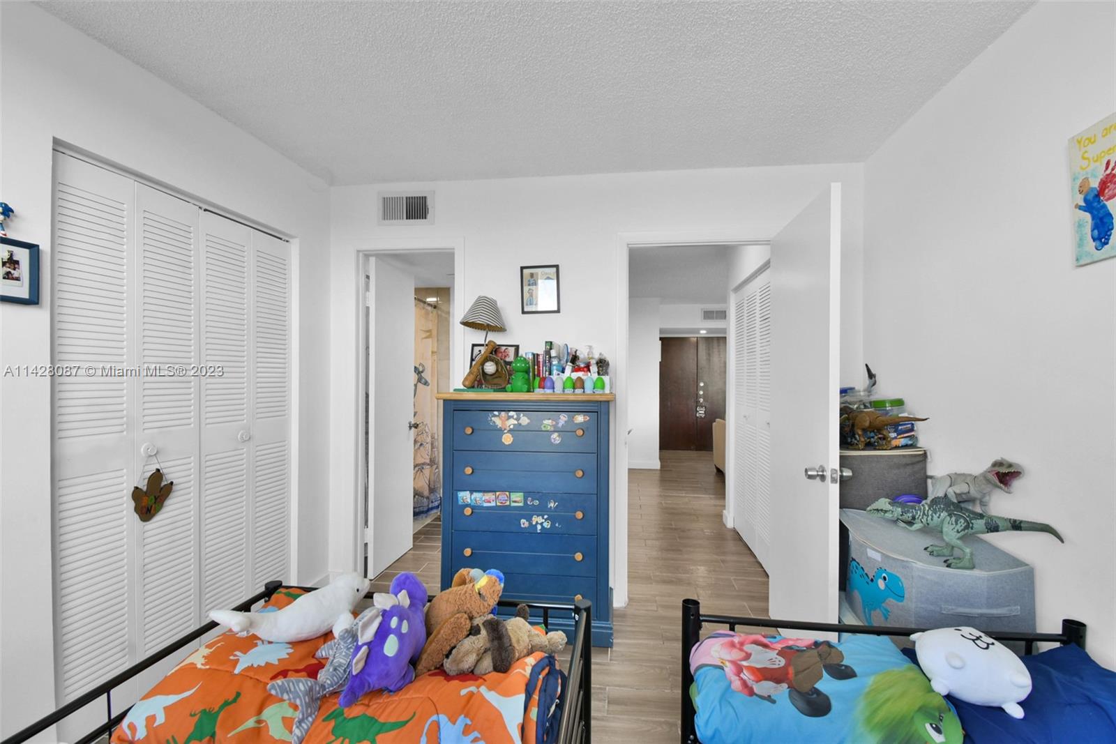 11800 Southwest 18th Street, Unit 5084 Miami, FL 33175 - Photo 22 of 44 a living room with furniture and wooden floor