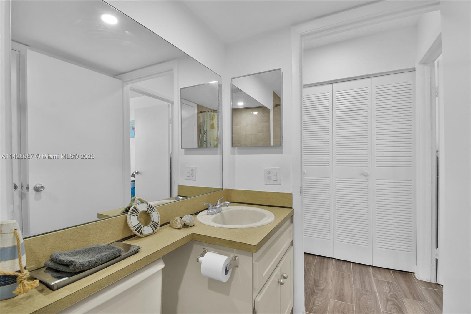 11800 Southwest 18th Street, Unit 5084 Miami, FL 33175 - Photo 25 of 44 a bathroom with a sink and a mirror