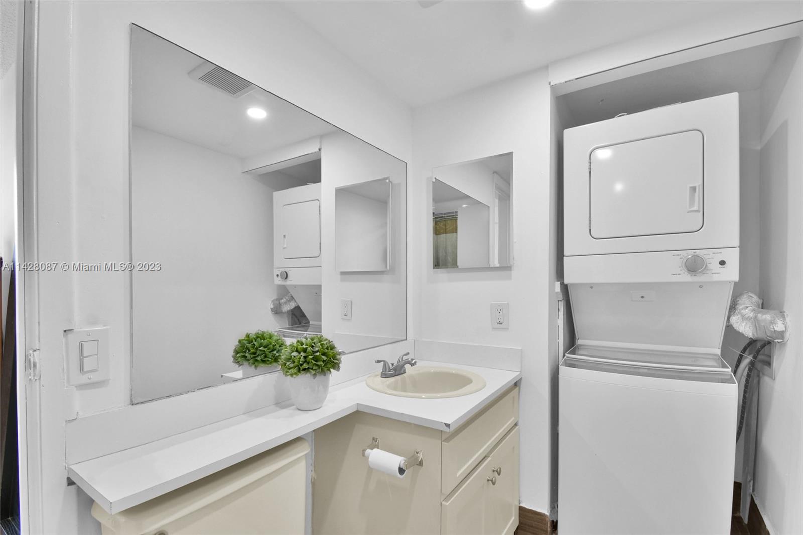 11800 Southwest 18th Street, Unit 5084 Miami, FL 33175 - Photo 27 of 44 a bathroom with a sink and a mirror
