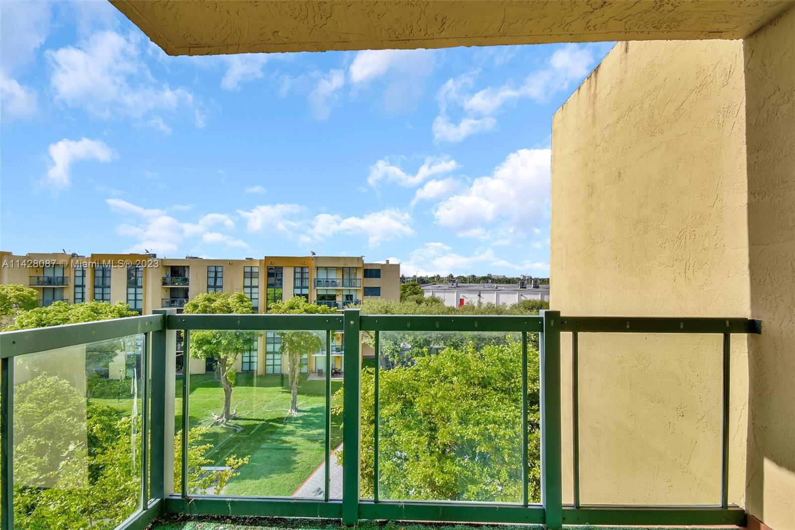 11800 Southwest 18th Street, Unit 5084 Miami, FL 33175 - Photo 29 of 44 a view of a large building with a outdoor space