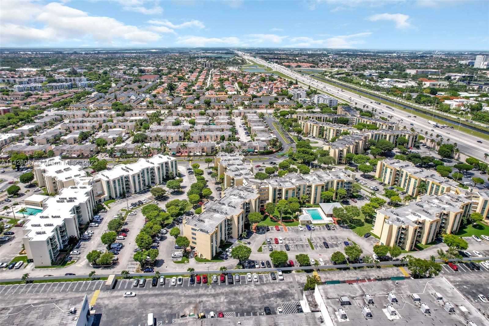 11800 Southwest 18th Street, Unit 5084 Miami, FL 33175 - Photo 35 of 44 an aerial view of a city with lots of residential buildings