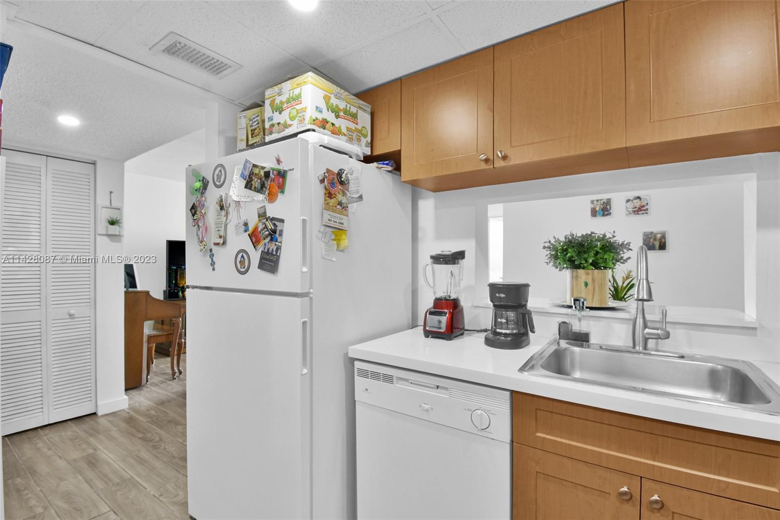 11800 Southwest 18th Street, Unit 5084 Miami, FL 33175 - Photo 9 of 44 a kitchen with a refrigerator and a sink
