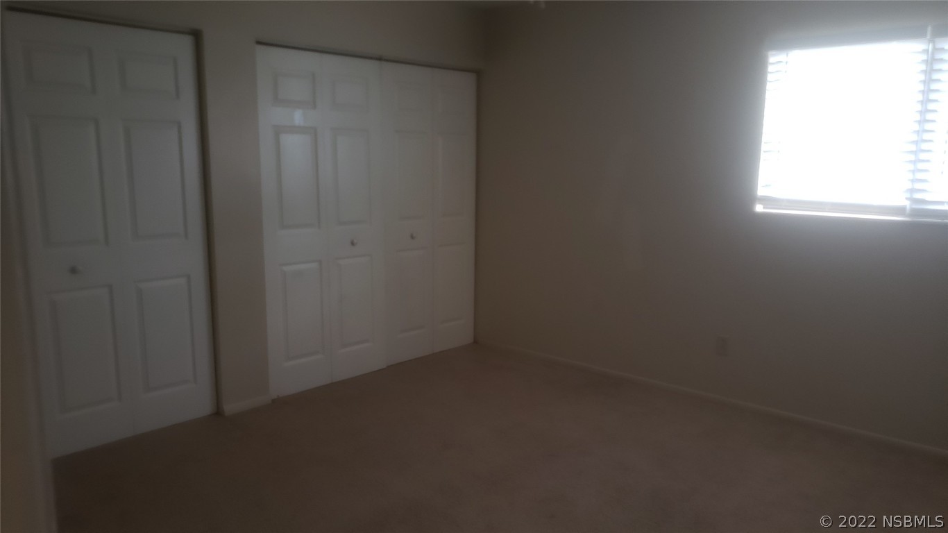322 Canal Road, Unit 22 Edgewater, FL 32132 - Photo 12 of 17 an empty room with a window