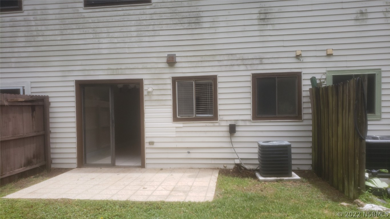 322 Canal Road, Unit 22 Edgewater, FL 32132 - Photo 14 of 17 a view of house with backyard