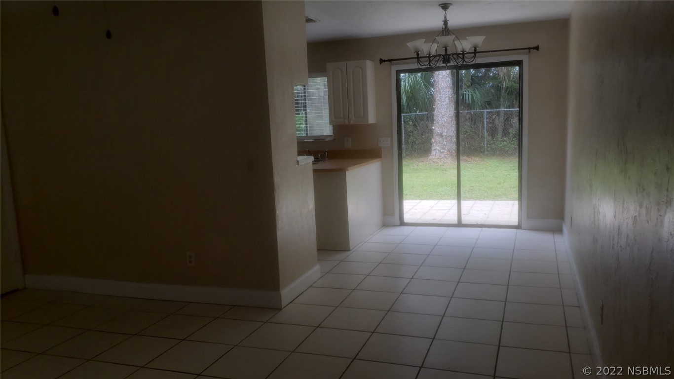 322 Canal Road, Unit 22 Edgewater, FL 32132 - Photo 3 of 17 a view of hallway with windows