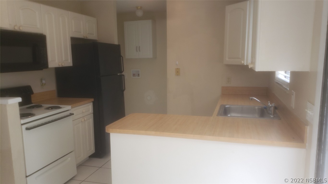 322 Canal Road, Unit 22 Edgewater, FL 32132 - Photo 5 of 17 a utility room with dryer and washer