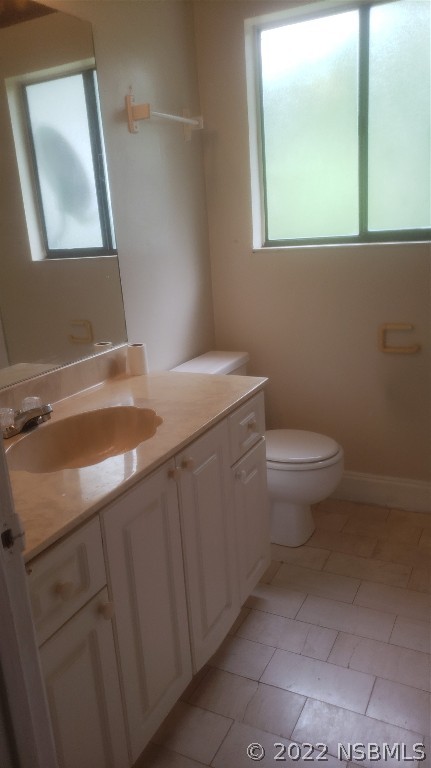 322 Canal Road, Unit 22 Edgewater, FL 32132 - Photo 8 of 17 a bathroom with a sink toilet and mirror