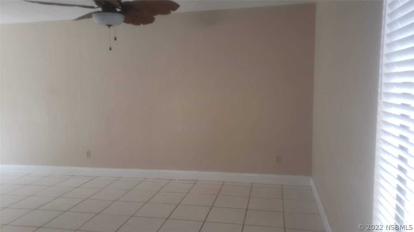 322 Canal Road, Unit 22 Edgewater, FL 32132 - Photo 9 of 17 an empty room with a window