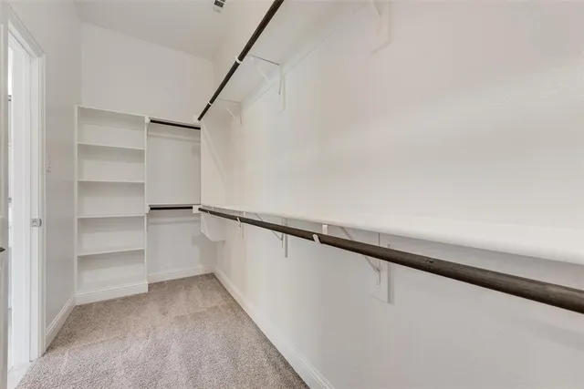 a spacious bathroom with a tub shower and sink