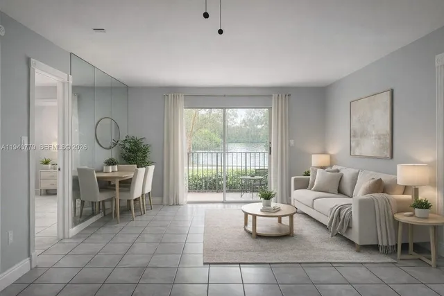 a living room with furniture and a floor to ceiling window