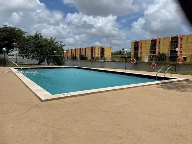 a view of swimming pool with a yard