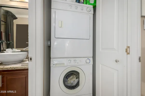 a view of a kitchen with washer and dryer