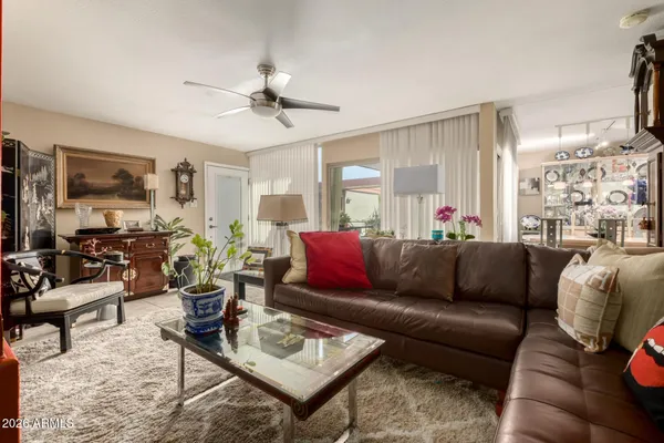 a living room with furniture and a large window