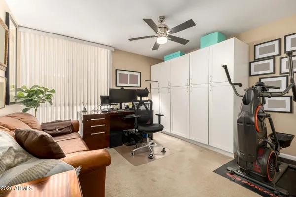 a bedroom with furniture and a window