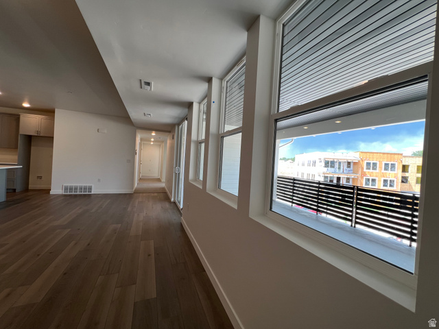 717 West W Coho Lane South, Unit 2F302 Midvale, UT 84047 - Photo 6 of 22 Expansive wood-finish flooring throughout the open concept living area
