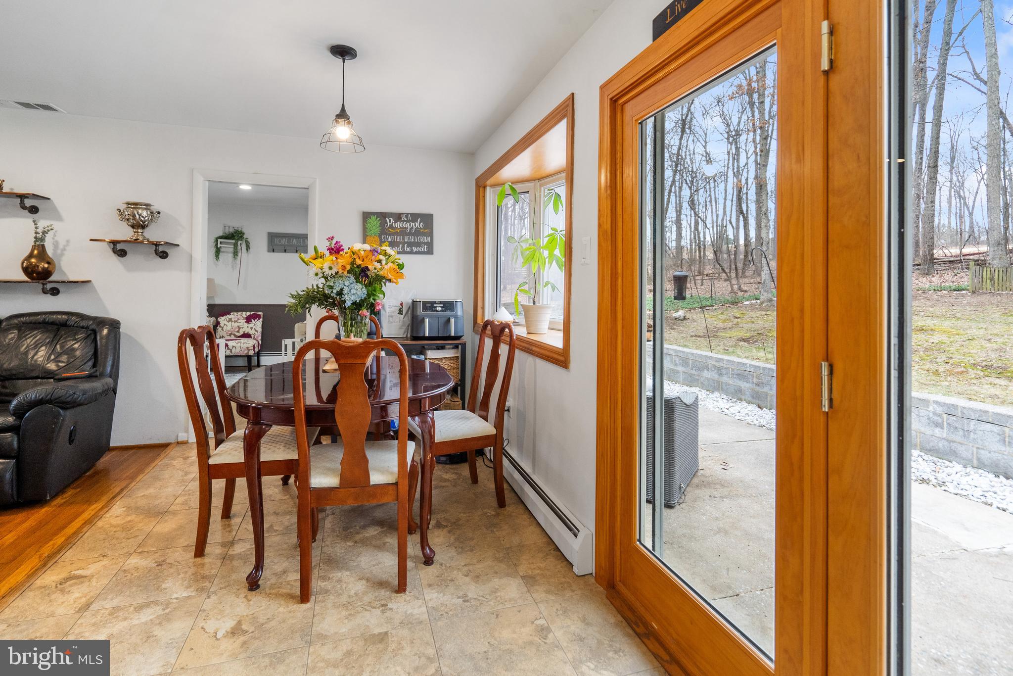 3605 Hoffman Mill Road Hampstead, MD 21074 - Photo 11 of 43 a dining room with furniture a livingroom and chandelier