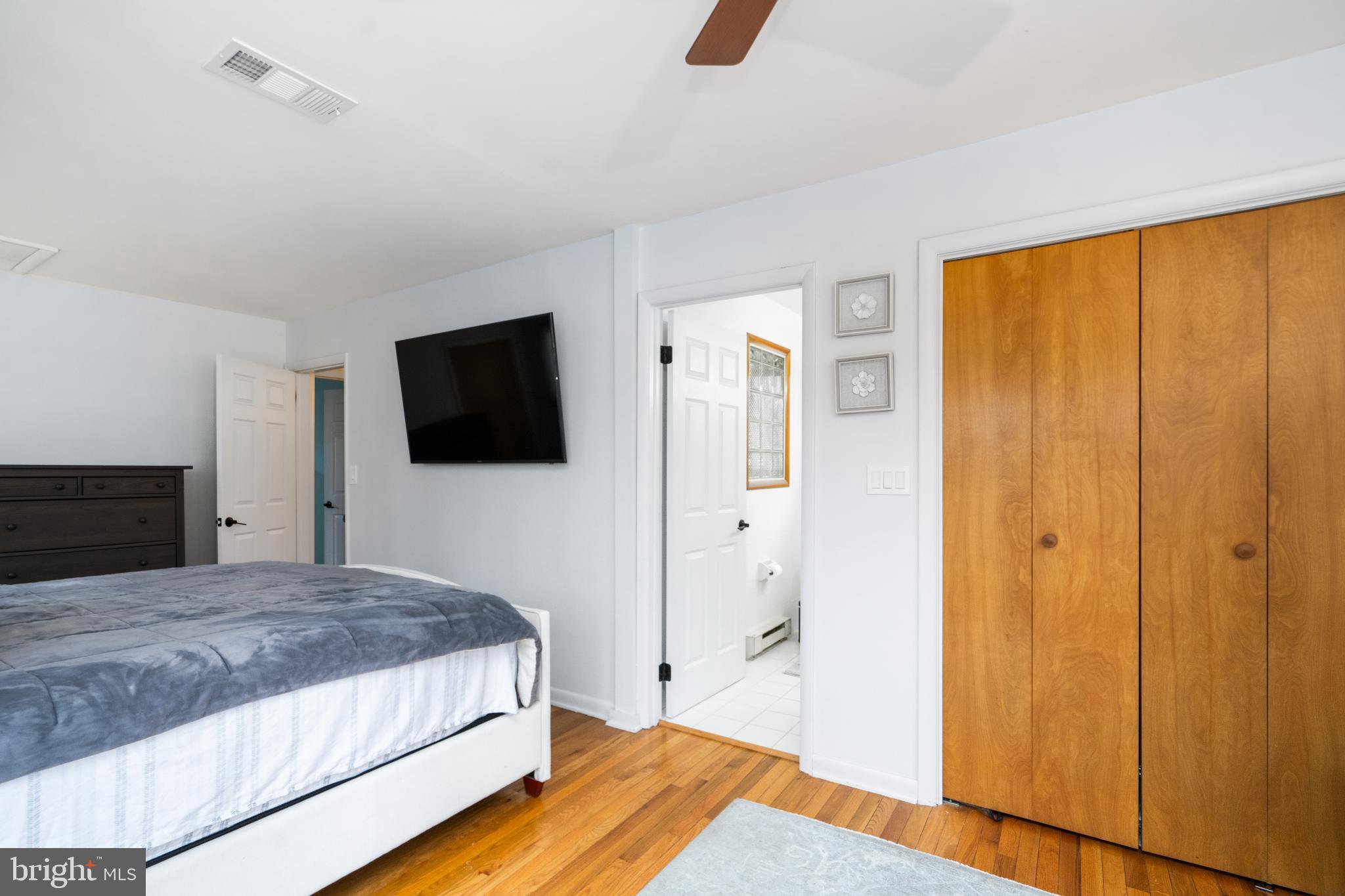 3605 Hoffman Mill Road Hampstead, MD 21074 - Photo 21 of 43 a bedroom with a bed and a flat screen tv