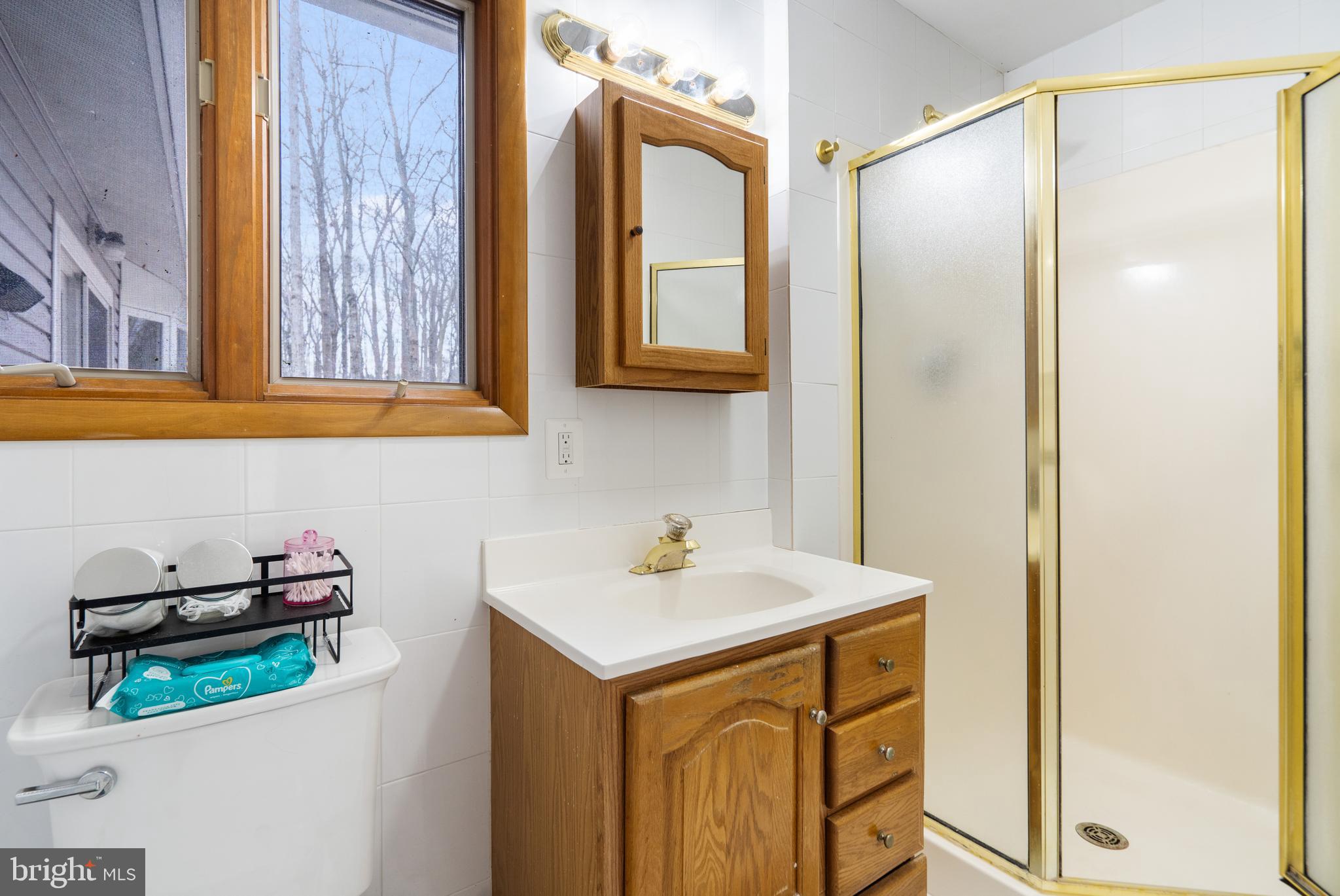 3605 Hoffman Mill Road Hampstead, MD 21074 - Photo 22 of 43 a bathroom with a sink and a mirror