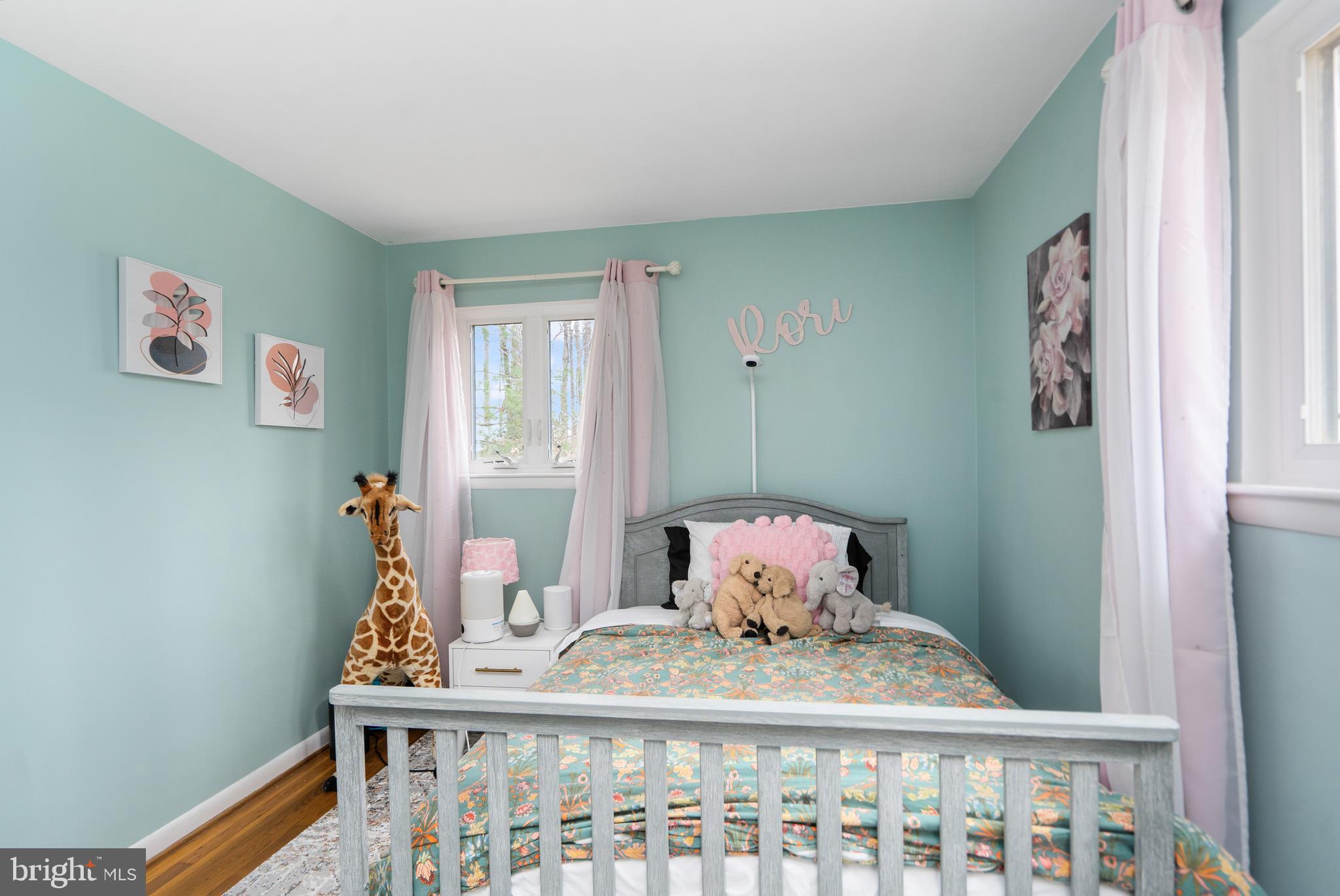 3605 Hoffman Mill Road Hampstead, MD 21074 - Photo 23 of 43 a bedroom with a bed and wooden floor