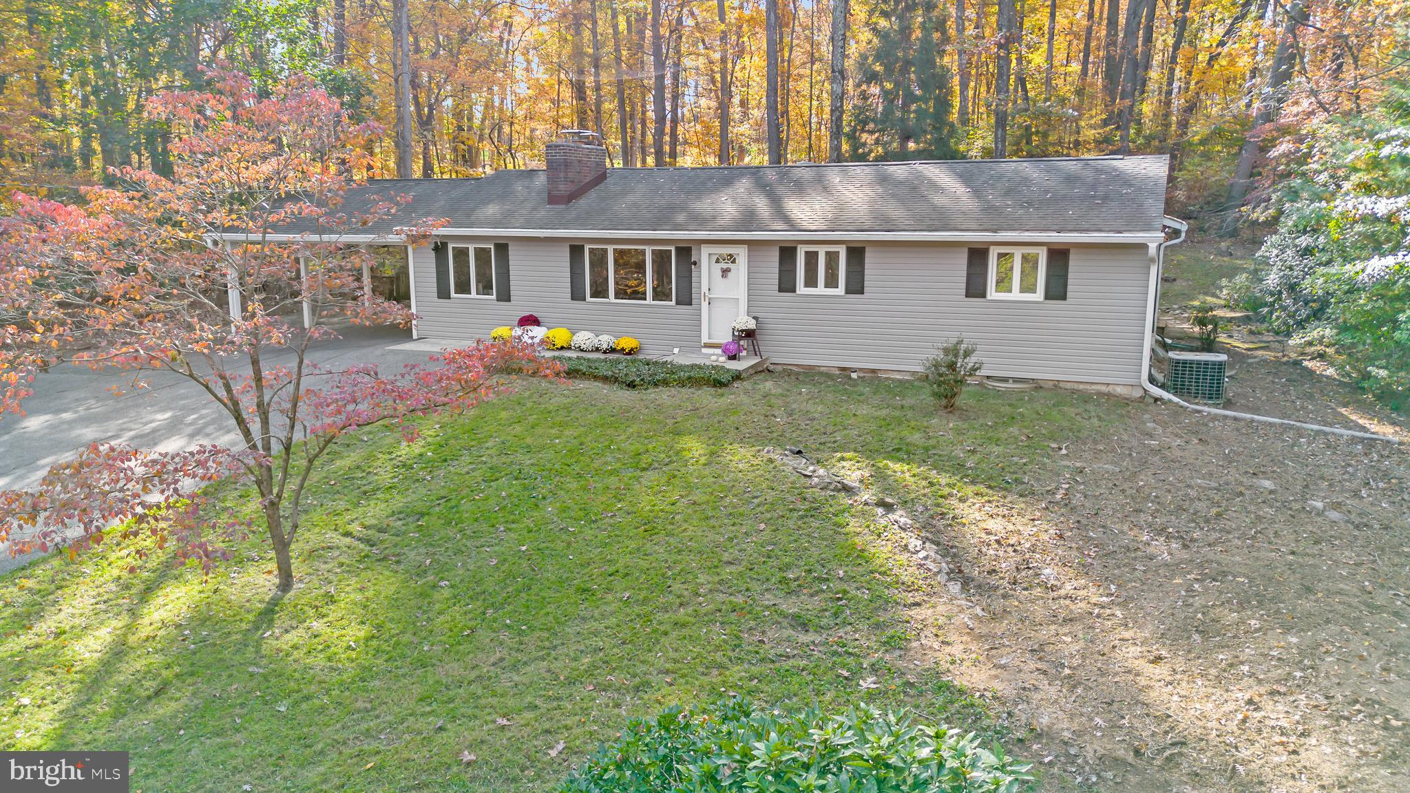 3605 Hoffman Mill Road Hampstead, MD 21074 - Photo 3 of 43 a view of a big house with a big yard and large tree