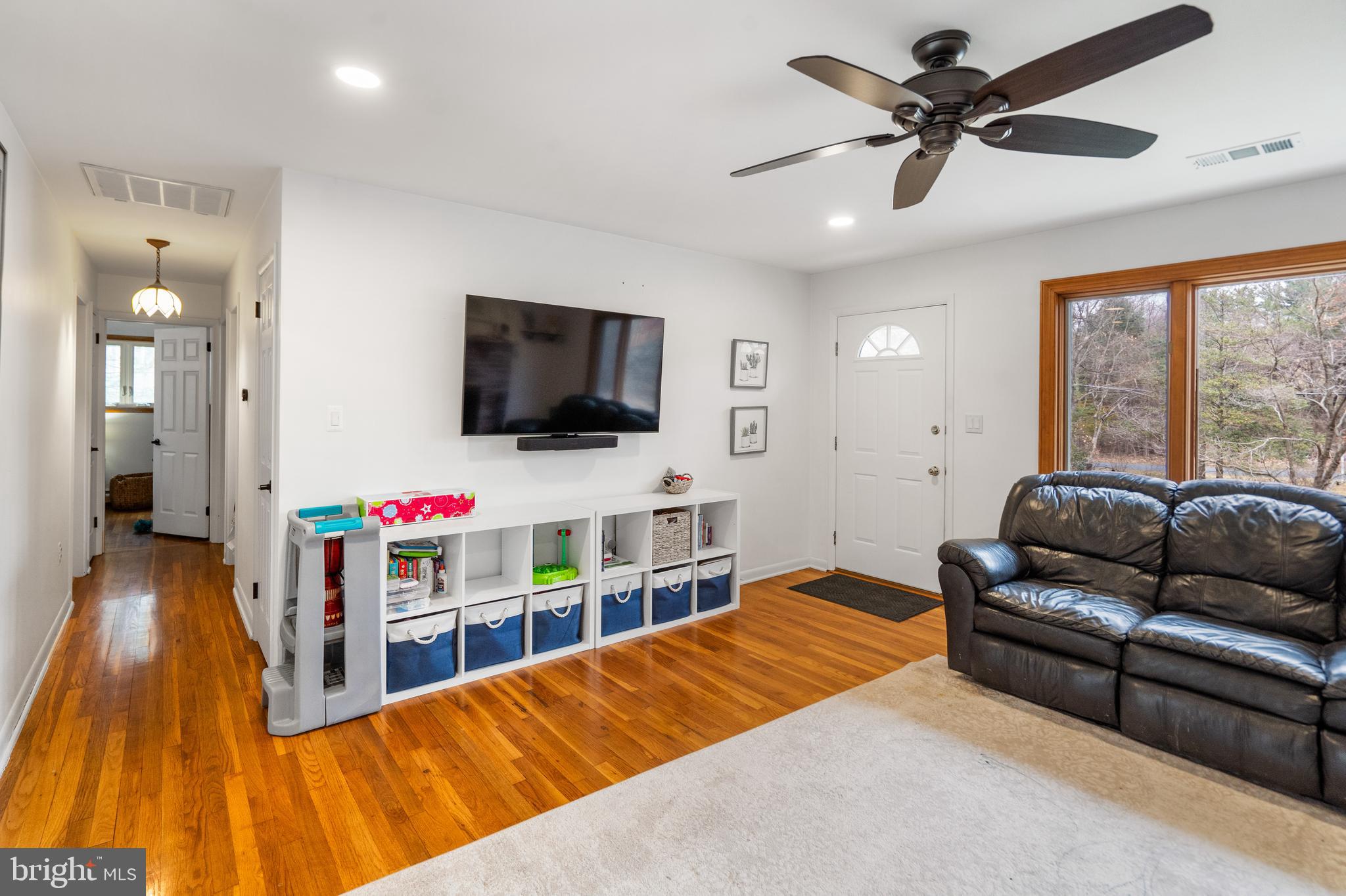 3605 Hoffman Mill Road Hampstead, MD 21074 - Photo 8 of 43 a living room with furniture and a flat screen tv